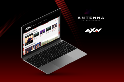 A picture of a laptop with an AXN streaming service open. On the right side of the picture are the logos of Antenna Entertainment and AXN